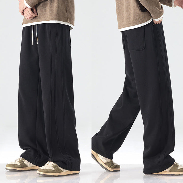 Men's loose sweatpants with decorative seam piping and drawstring