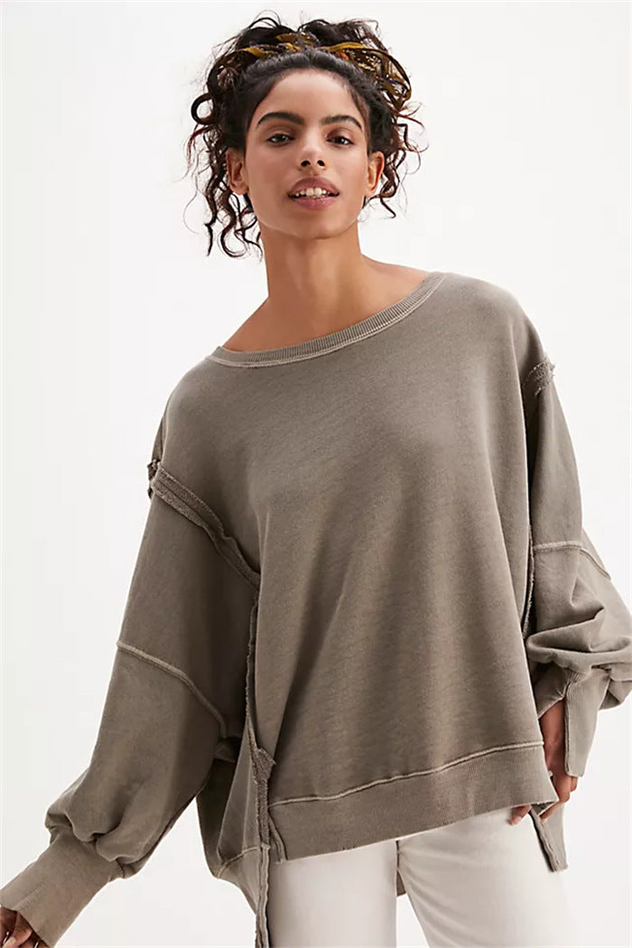 Women's oversized sweatshirt with balloon sleeves, open seam stitches, and side slits Hudson & Parker