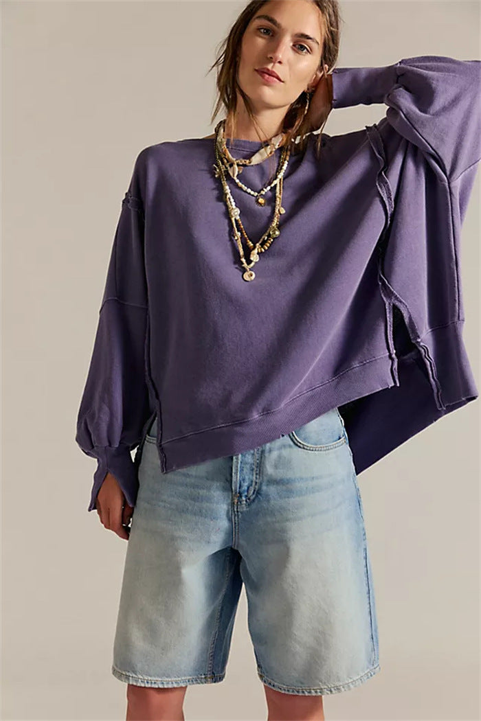 Women's oversized sweatshirt with balloon sleeves, open seam stitches, and side slits Hudson & Parker