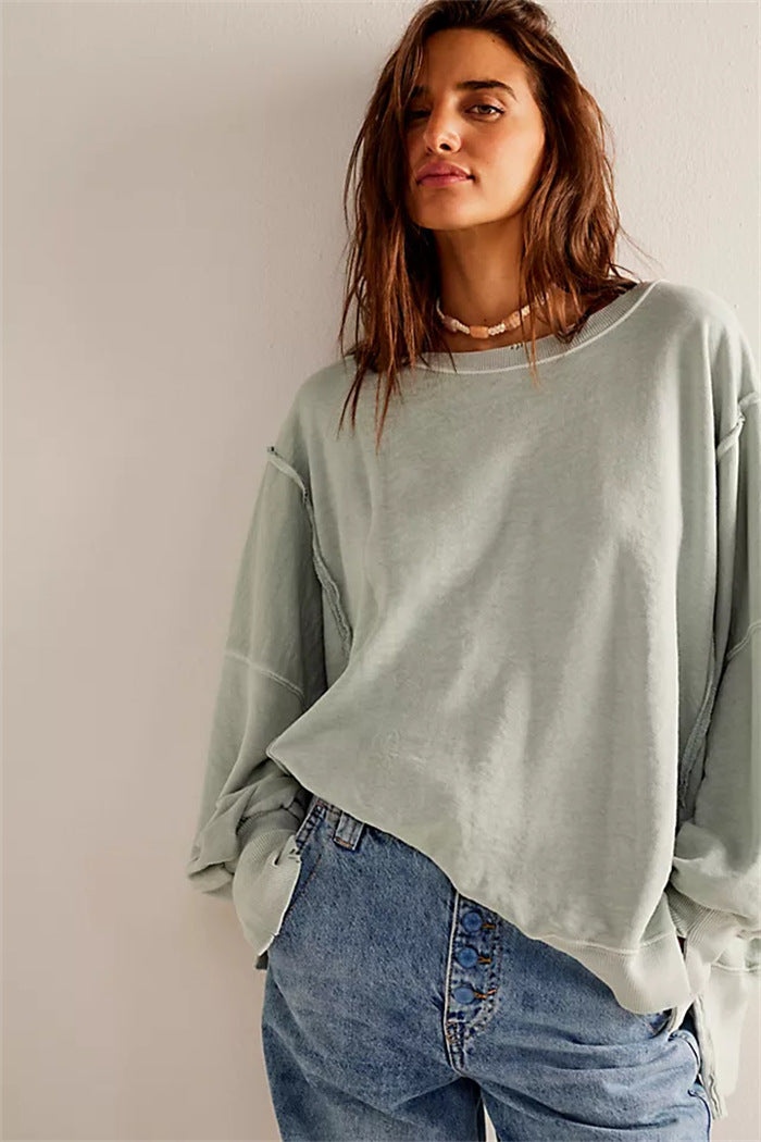 Women's oversized sweatshirt with balloon sleeves, open seam stitches, and side slits Hudson & Parker