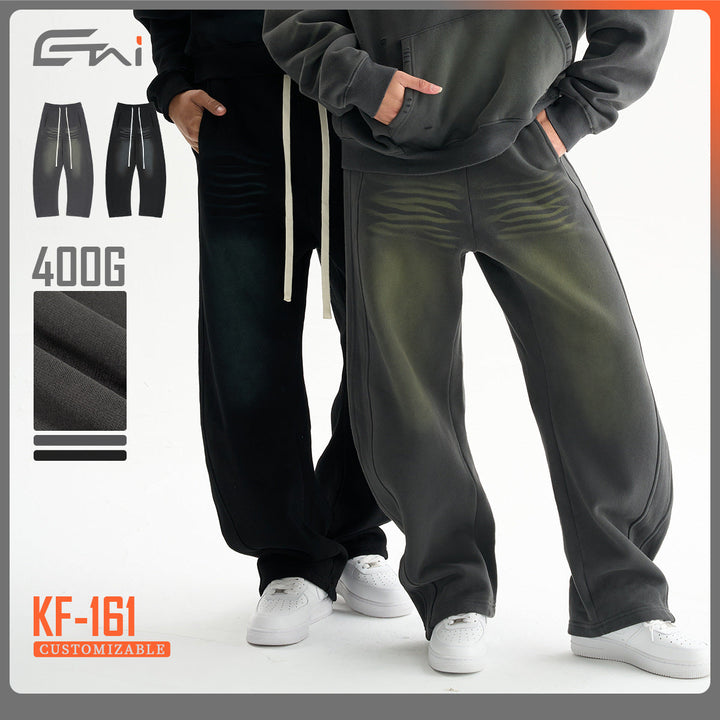 Men's baggy sweatpants with low crotch, contrasting decorative seams, and extra long drawstrings.