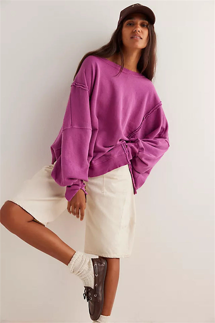 Women's oversized sweatshirt with balloon sleeves, open seam stitches, and side slits Hudson & Parker
