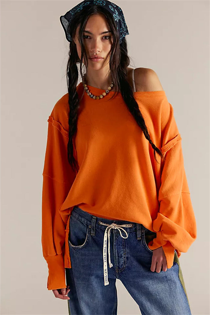 Women's oversized sweatshirt with balloon sleeves, open seam stitches, and side slits Hudson & Parker