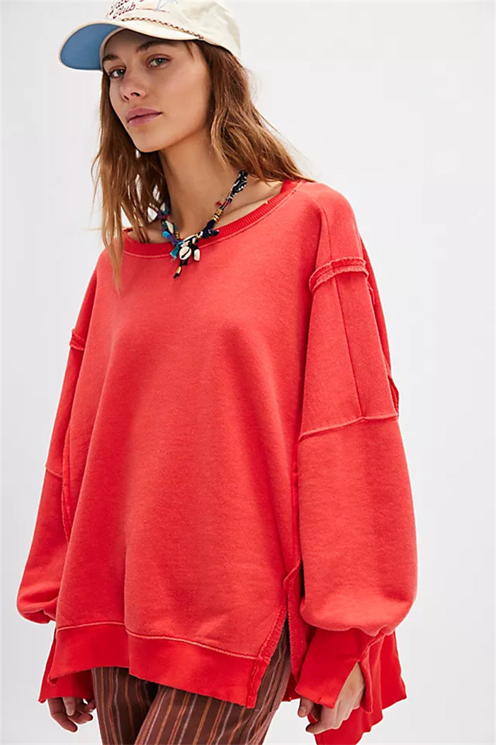 Women's oversized sweatshirt with balloon sleeves, open seam stitches, and side slits Hudson & Parker
