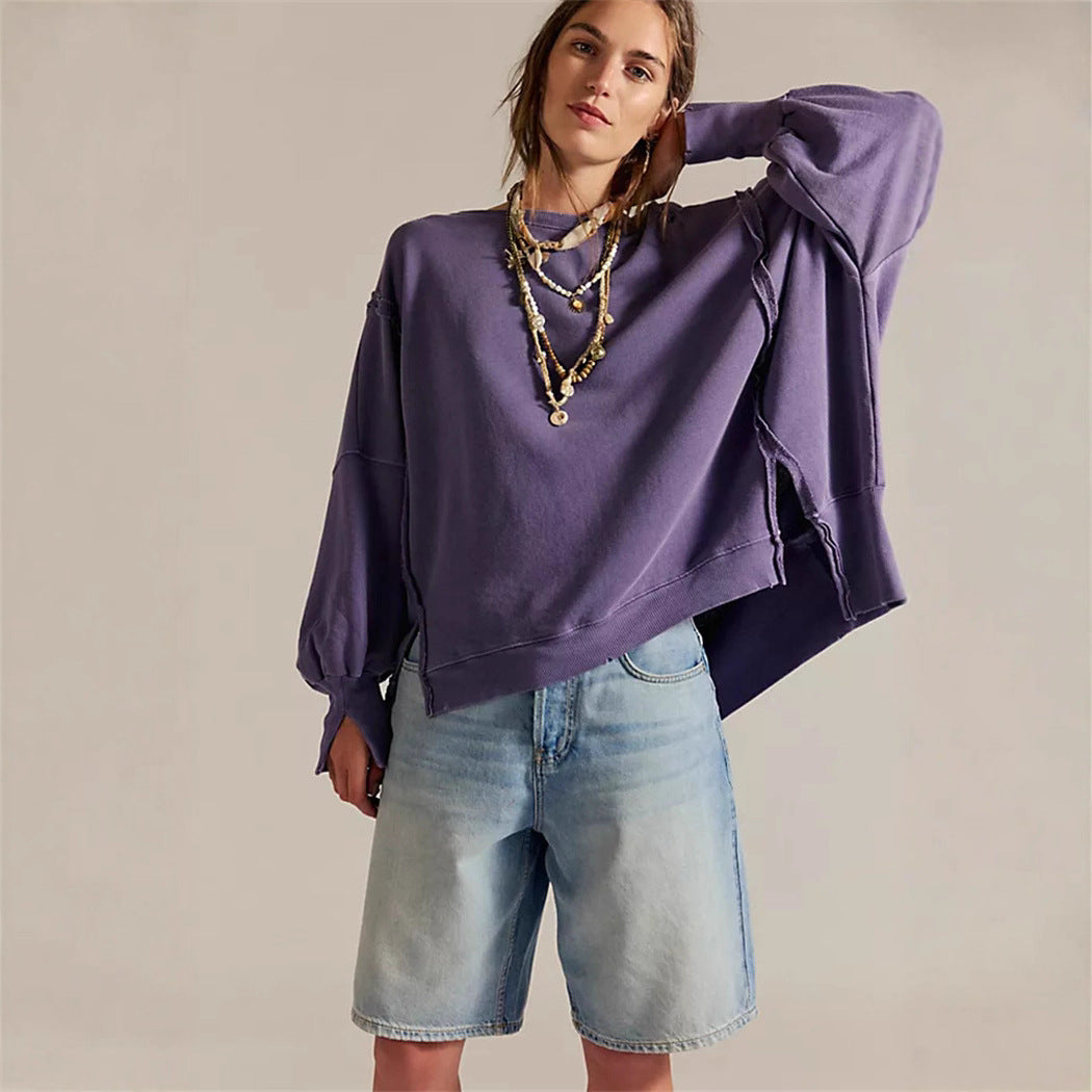 Women's oversized sweatshirt with balloon sleeves, open seam stitches, and side slits Hudson & Parker