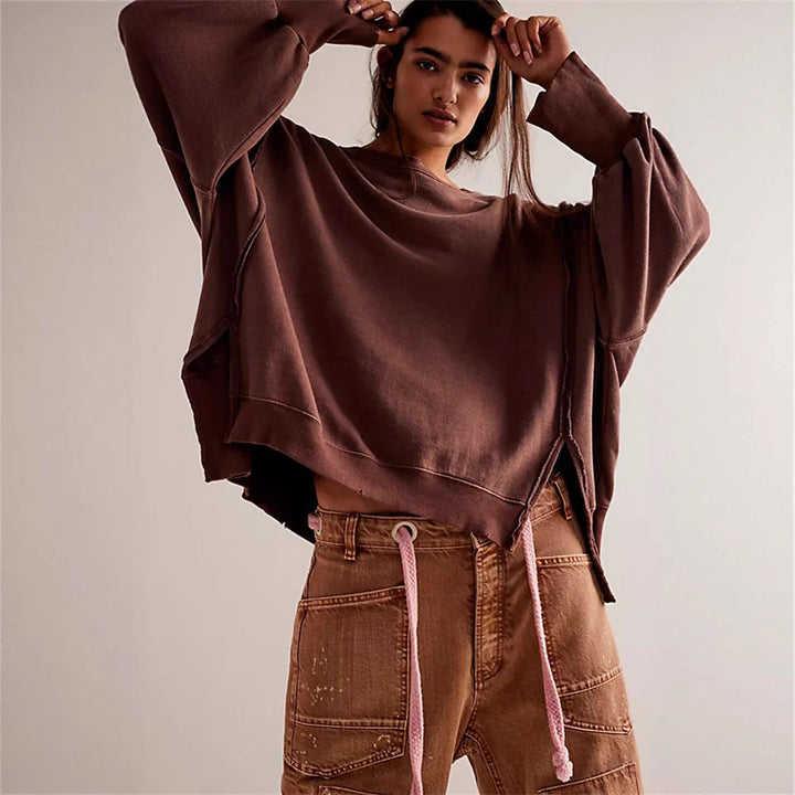 Women's oversized sweatshirt with balloon sleeves, open seam stitches, and side slits Hudson & Parker