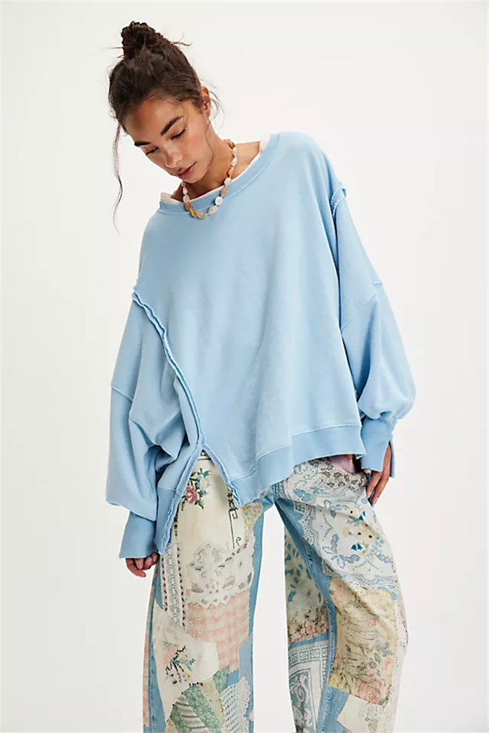 Women's oversized sweatshirt with balloon sleeves, open seam stitches, and side slits Hudson & Parker