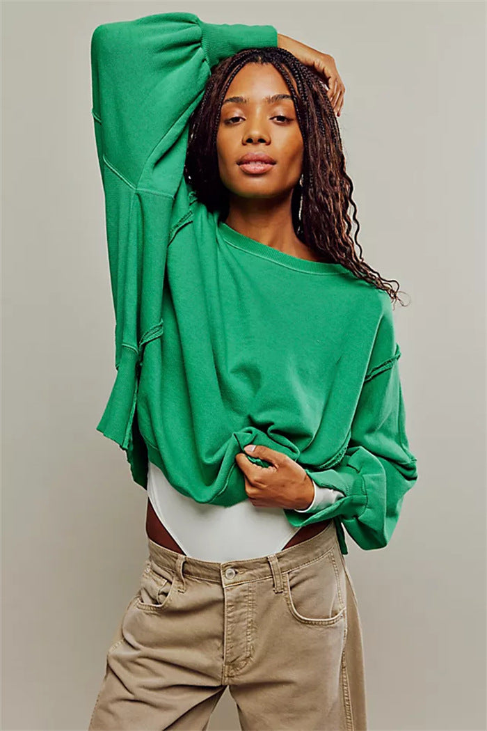 Women's oversized sweatshirt with balloon sleeves, open seam stitches, and side slits Hudson & Parker