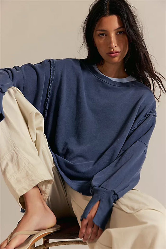 Women's oversized sweatshirt with balloon sleeves, open seam stitches, and side slits Hudson & Parker