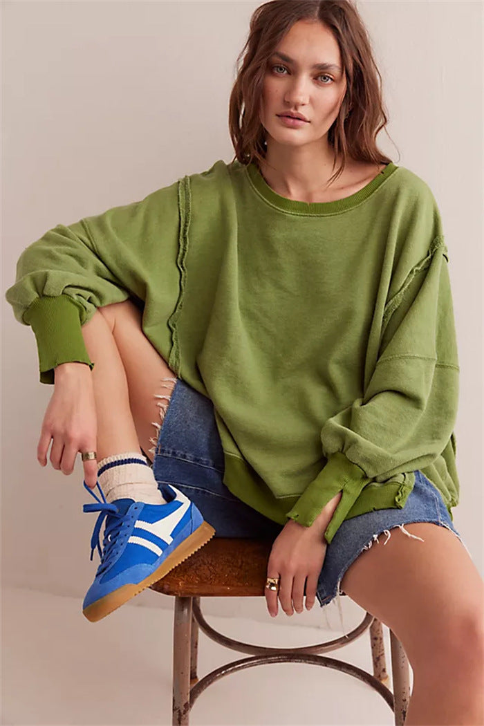 Women's oversized sweatshirt with balloon sleeves, open seam stitches, and side slits Hudson & Parker