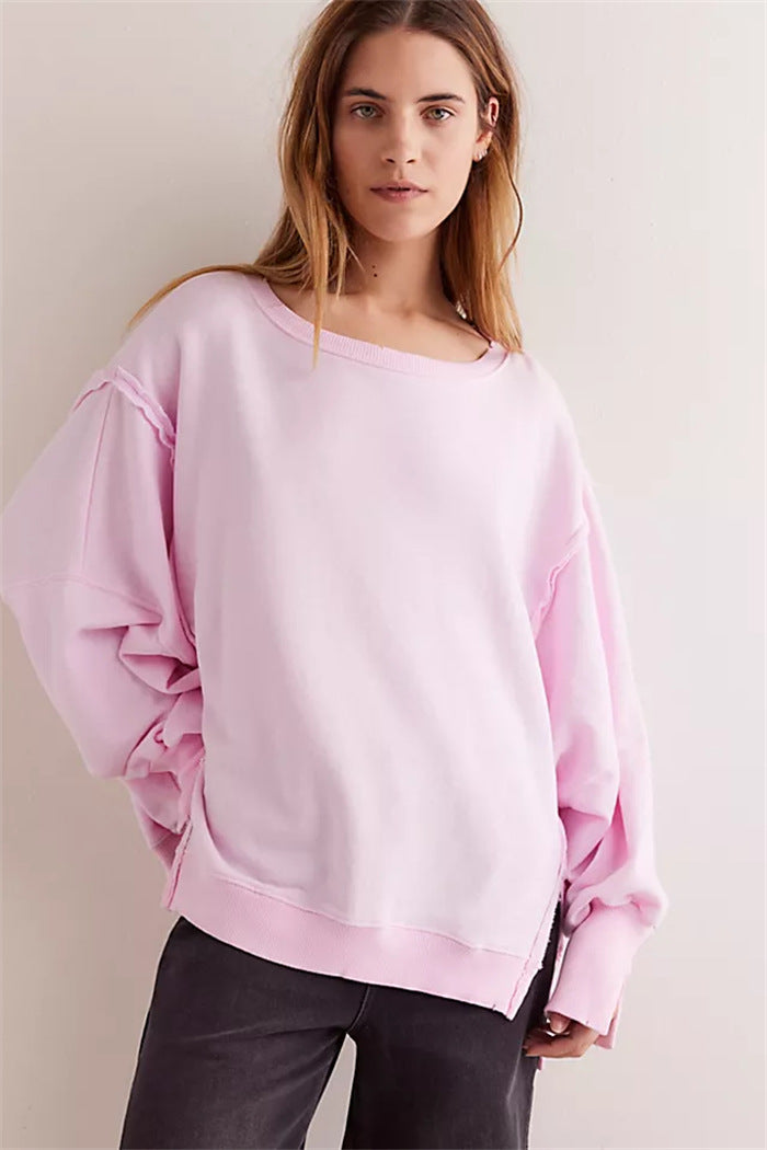 Women's oversized sweatshirt with balloon sleeves, open seam stitches, and side slits Hudson & Parker