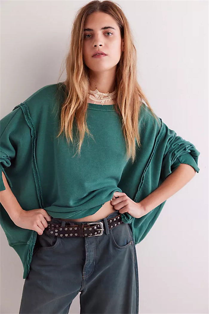 Women's oversized sweatshirt with balloon sleeves, open seam stitches, and side slits Hudson & Parker