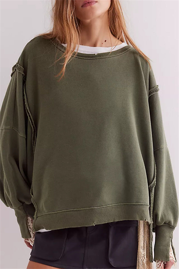 Women's oversized sweatshirt with balloon sleeves, open seam stitches, and side slits Hudson & Parker