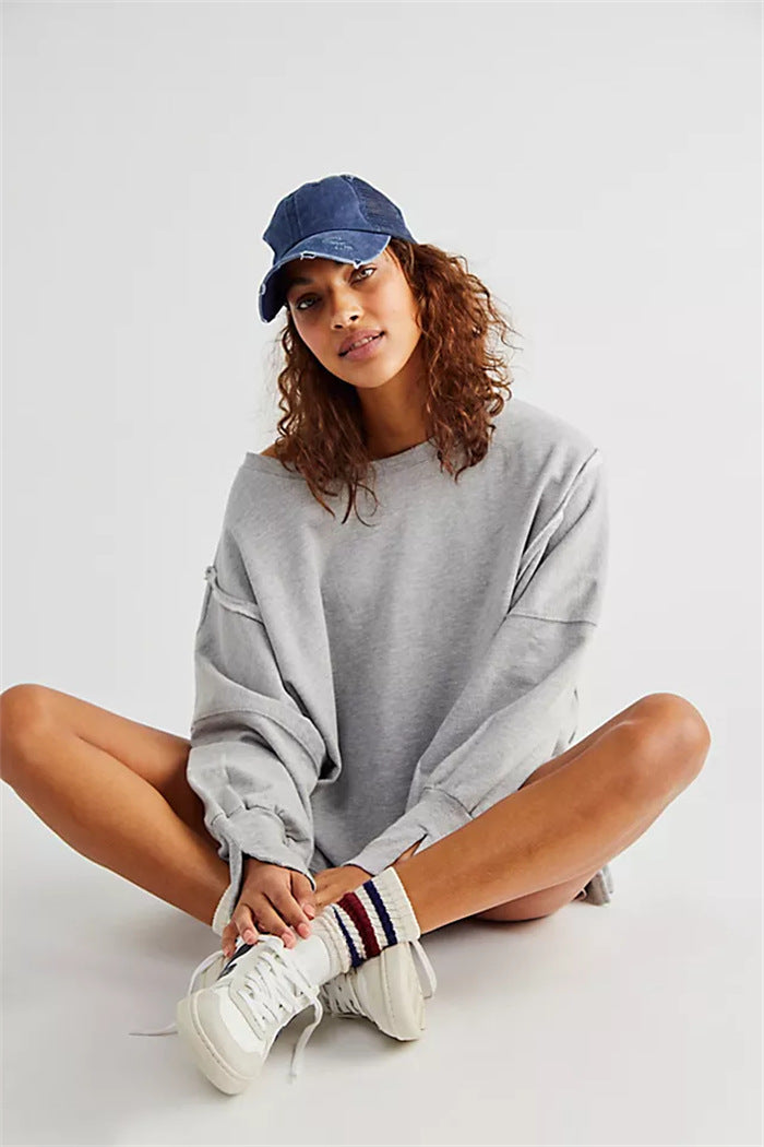 Women's oversized sweatshirt with balloon sleeves, open seam stitches, and side slits Hudson & Parker
