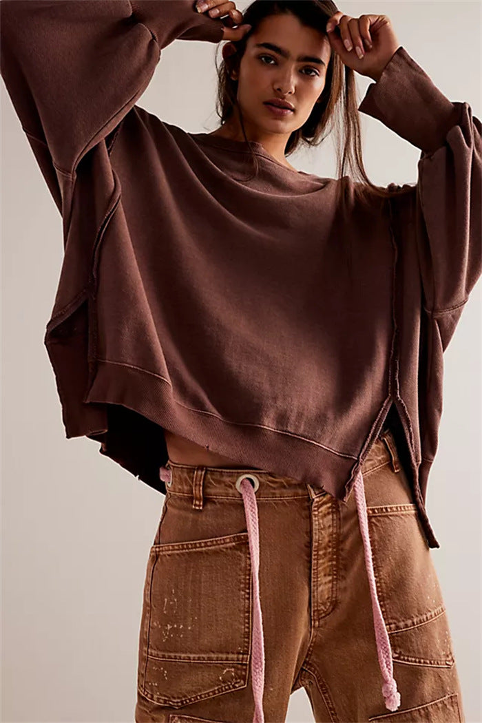 Women's oversized sweatshirt with balloon sleeves, open seam stitches, and side slits Hudson & Parker