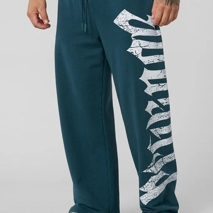 Men's wide sweatpants made of brushed fleece with side vintage print and drawstring waistband Hudson & Parker
