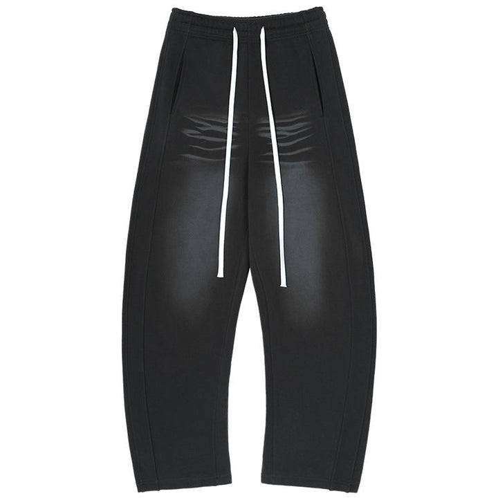 Men's baggy sweatpants with low crotch, contrasting decorative seams, and extra long drawstrings.