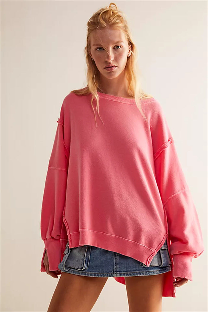 Women's oversized sweatshirt with balloon sleeves, open seam stitches, and side slits Hudson & Parker