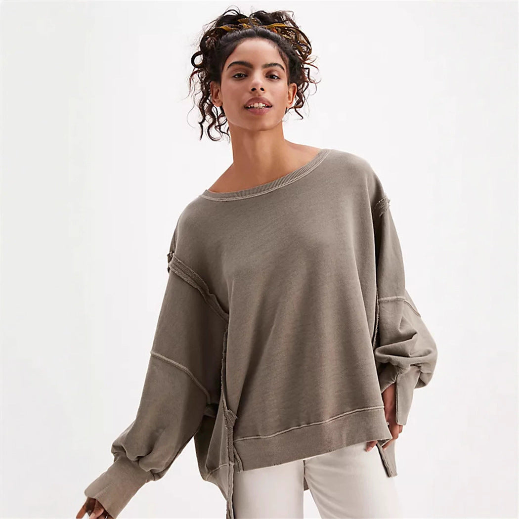 Women's oversized sweatshirt with balloon sleeves, open seam stitches, and side slits Hudson & Parker