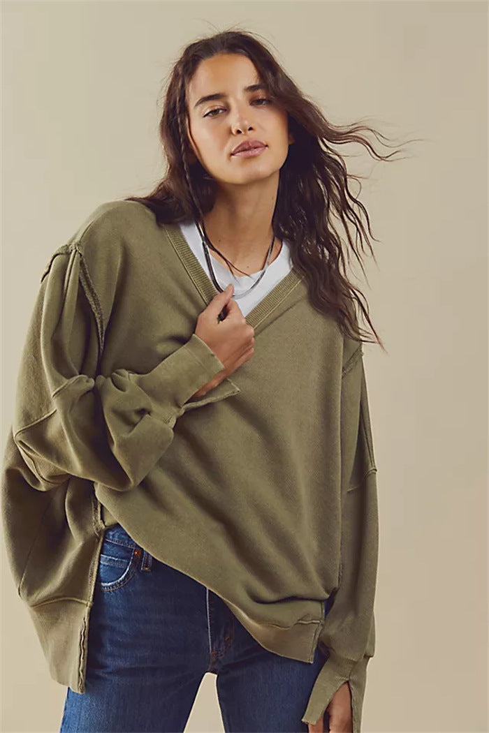 Women's oversized sweatshirt with balloon sleeves, open seam stitches, and side slits Hudson & Parker
