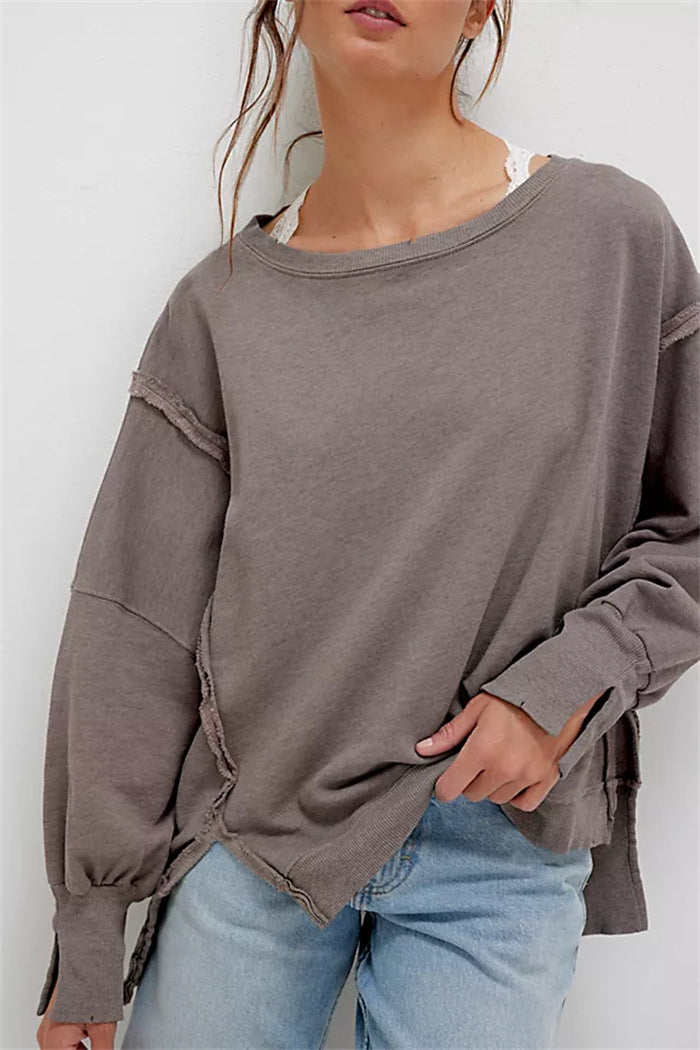 Women's oversized sweatshirt with balloon sleeves, open seam stitches, and side slits Hudson & Parker
