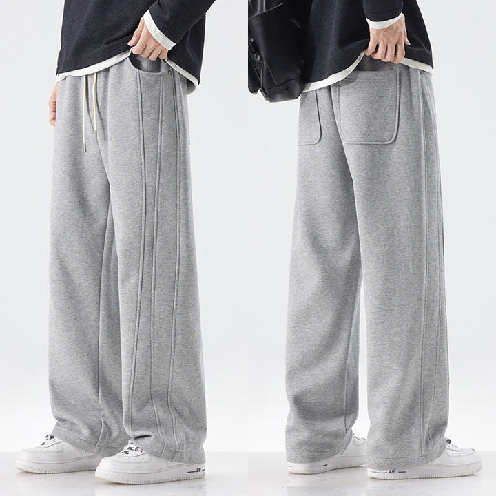 Men's loose sweatpants with decorative seam piping and drawstring