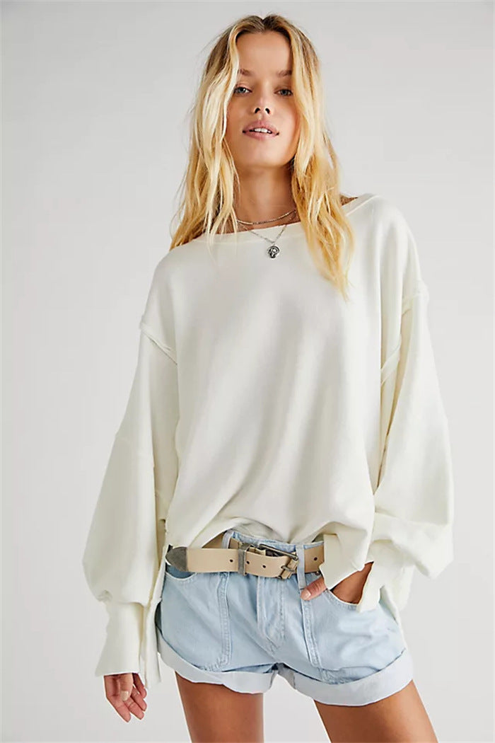 Women's oversized sweatshirt with balloon sleeves, open seam stitches, and side slits Hudson & Parker