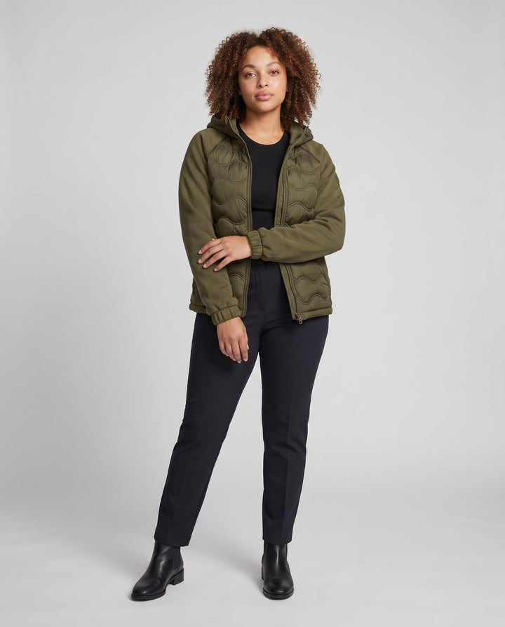 Women's quilted hybrid hoodie jacket with fleece sleeves, elastic cuffs, and wave quilting