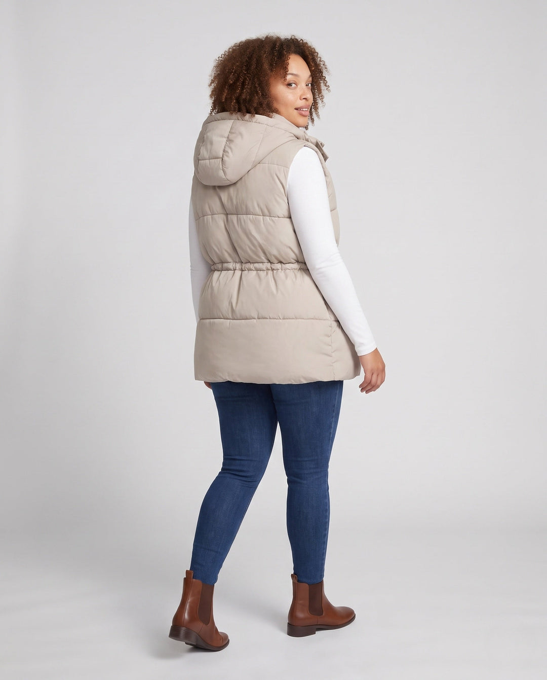 Women’s padded hooded vest with waistbelt and high collar