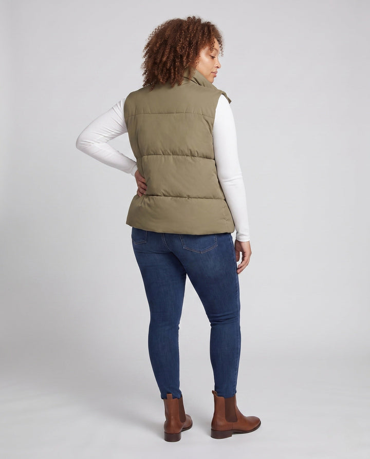 Women’s short padded hooded vest in boxy cut with high collar and slanted pockets