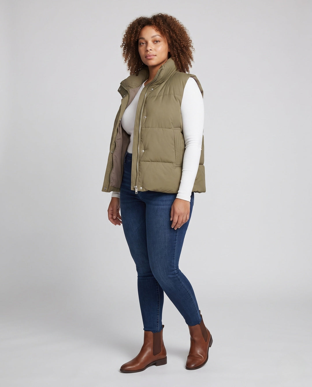 Women’s short padded hooded vest in boxy cut with high collar and slanted pockets
