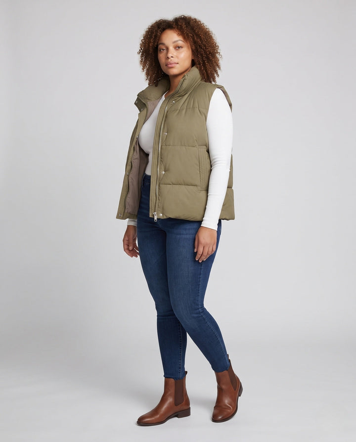 Women’s short padded hooded vest in boxy cut with high collar and slanted pockets