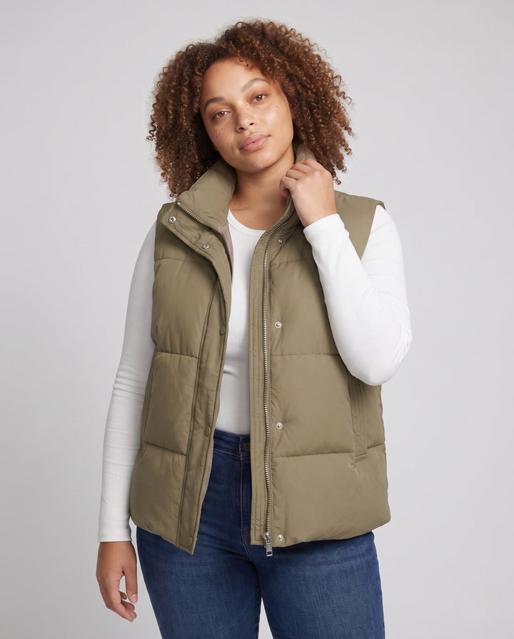Women’s short padded hooded vest in boxy cut with high collar and slanted pockets