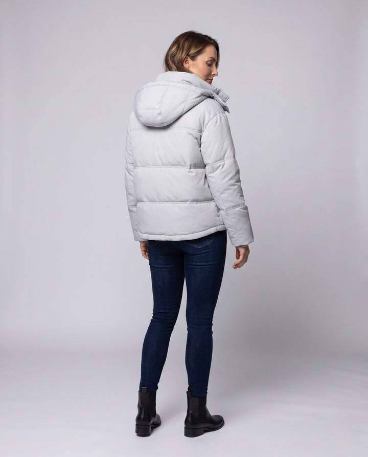 Women's short quilted hooded blouse with teddy inner collar, concealed two-way zipper, and adjustable hem