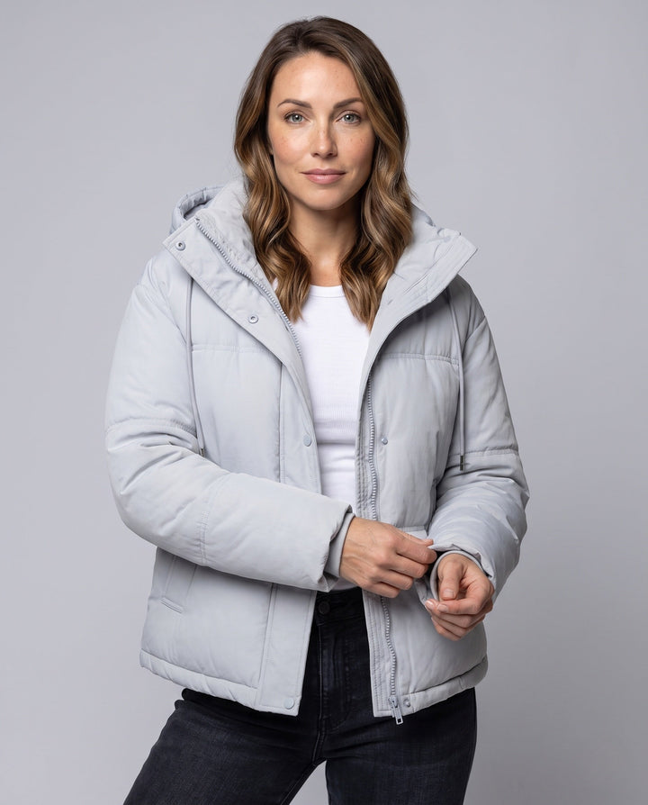 Women's short quilted hooded blouse with teddy inner collar, concealed two-way zipper, and adjustable hem
