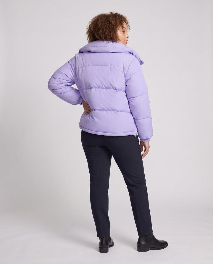 Ladies' short padded hooded puffer with oversized hood, flap pockets, and adjustable hem