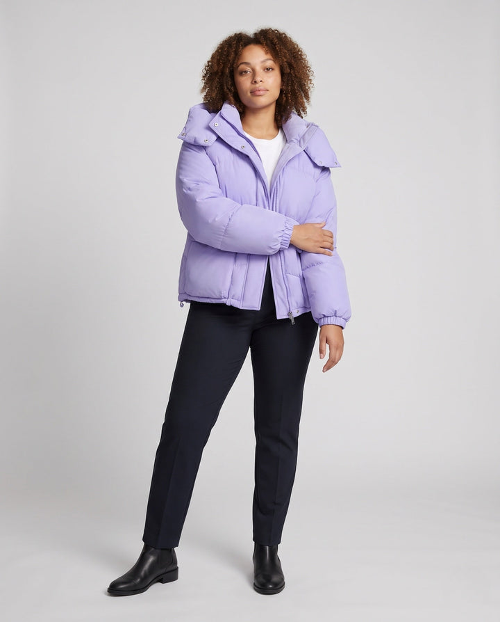 Ladies' short padded hooded puffer with oversized hood, flap pockets, and adjustable hem