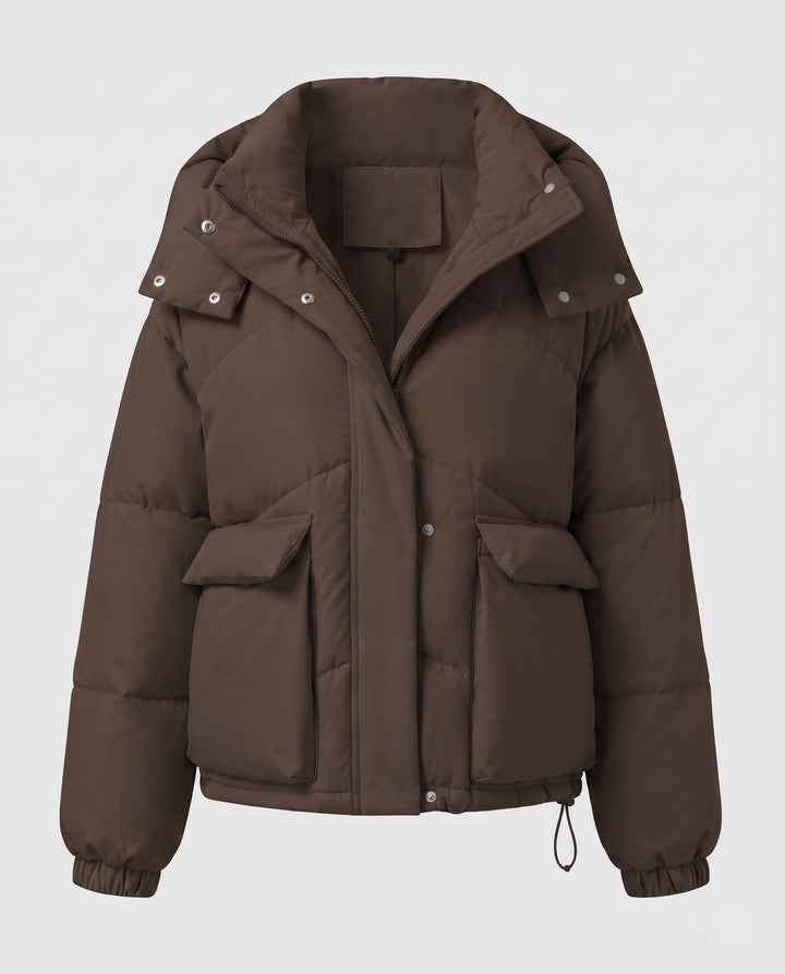 Ladies' short padded hooded puffer with oversized hood, flap pockets, and adjustable hem