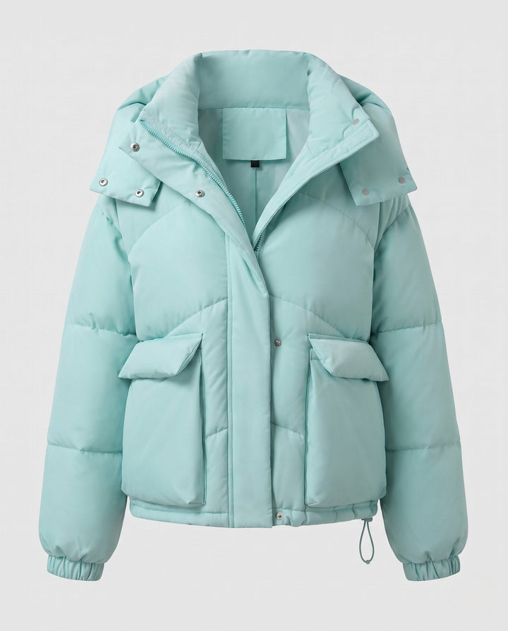Ladies' short padded hooded puffer with oversized hood, flap pockets, and adjustable hem