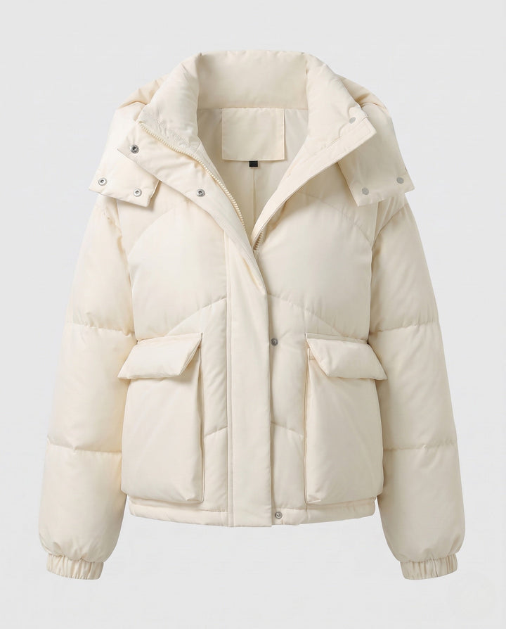 Ladies' short padded hooded puffer with oversized hood, flap pockets, and adjustable hem