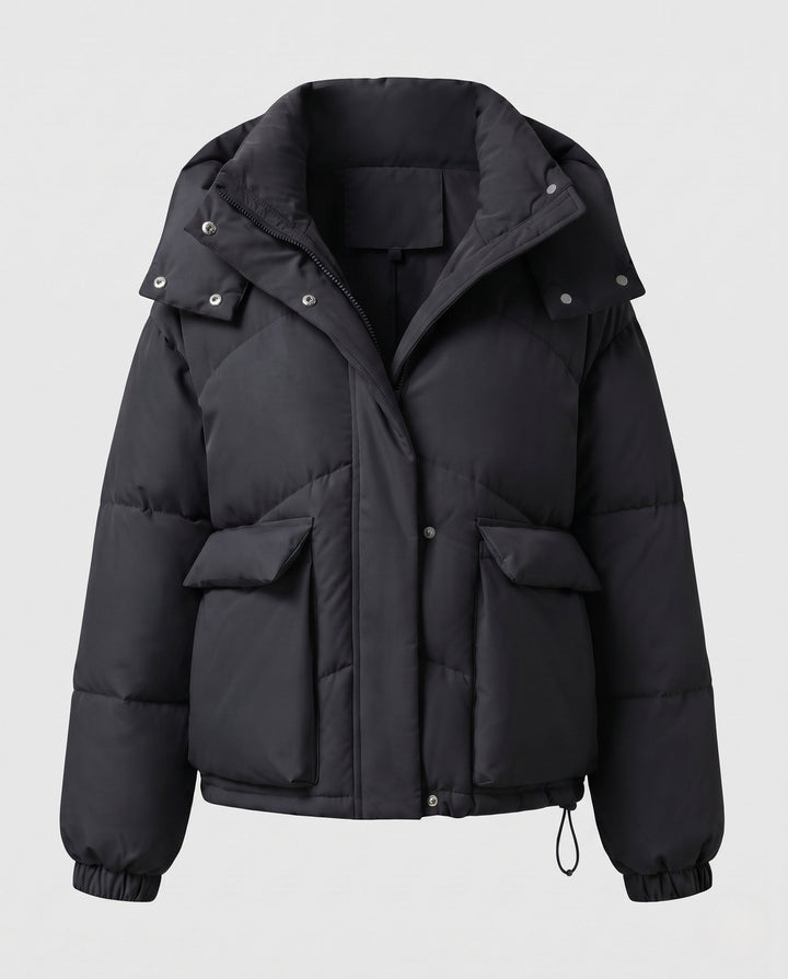 Ladies' short padded hooded puffer with oversized hood, flap pockets, and adjustable hem