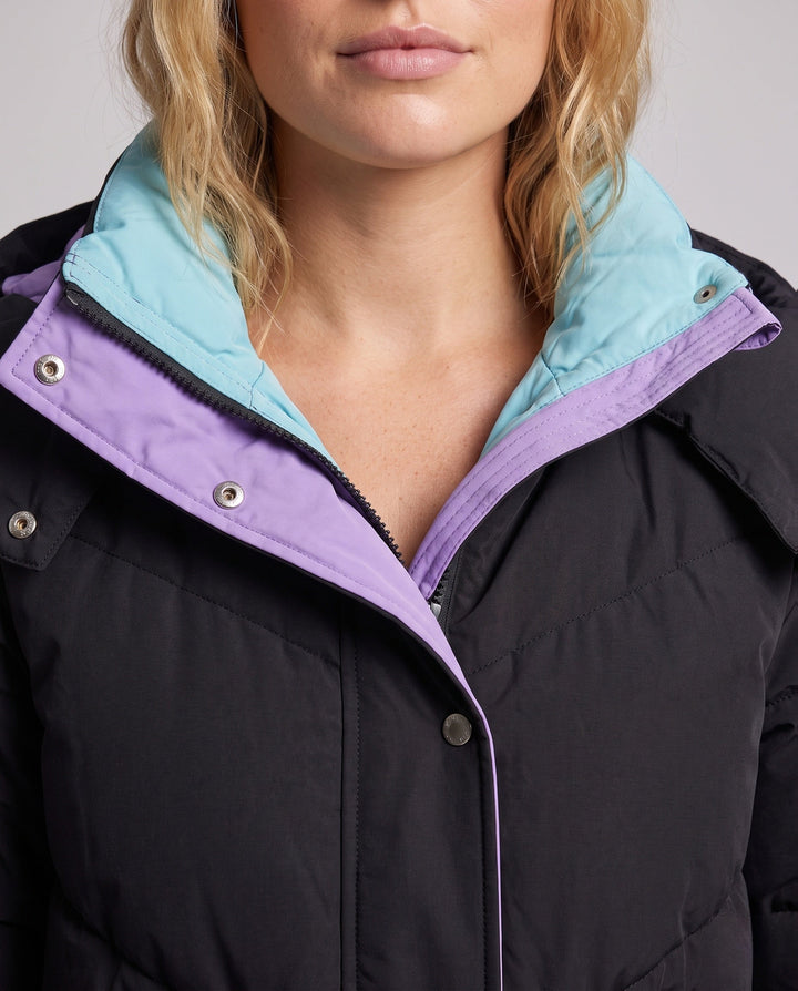 Women's longer padded hooded coat with large flap and patch pocket as well as elastic cuffs