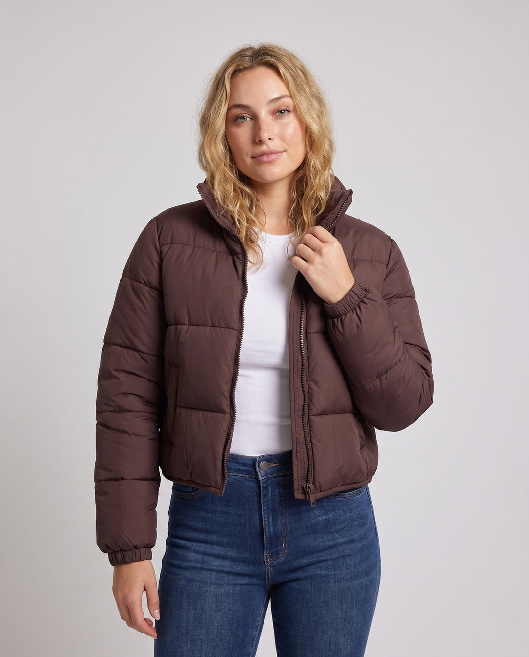 Women's ultra-lightweight hoodless oversized puffer with high standing collar, silent outer shell, and thermally insulating padding