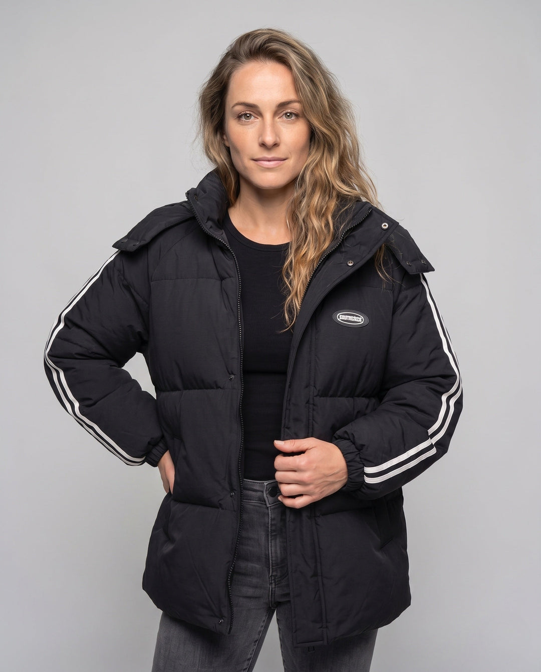 Unisex oversized quilted jacket with contrast stripes on sleeves, high-closing collar, and hood placket