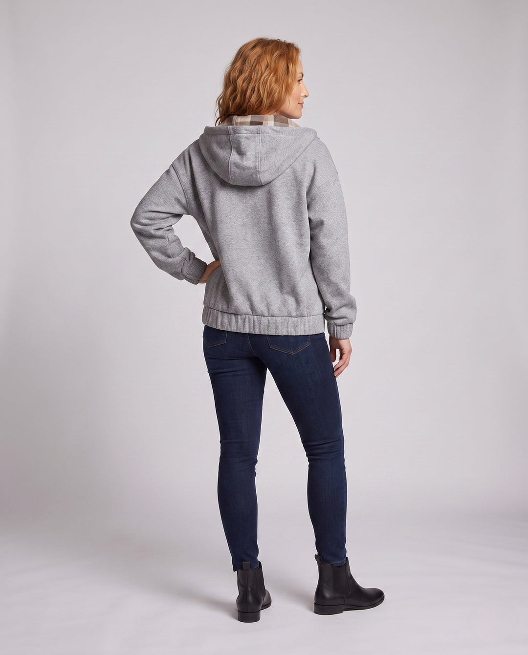 Women's oversized hoodie jacket with checked hood lining, elastic hem, and concealed side pockets