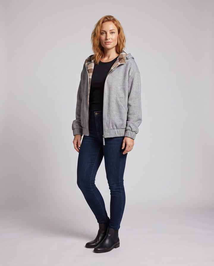 Women's oversized hoodie jacket with checked hood lining, elastic hem, and concealed side pockets
