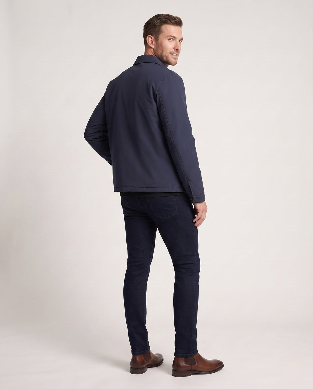 Men's quilted down jacket with minimalist outer shell and stand-up collar