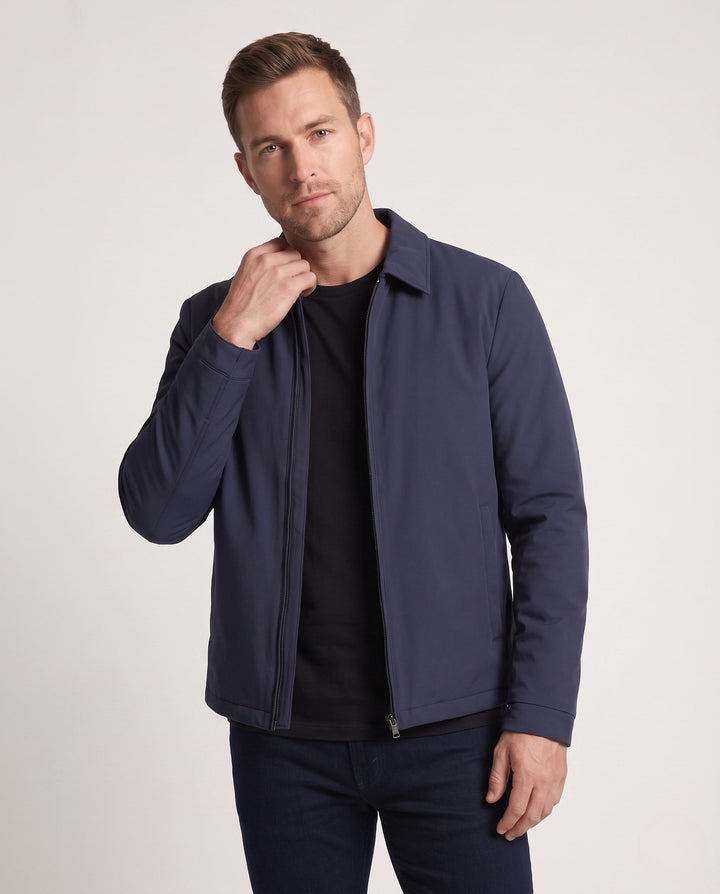 Men's quilted down jacket with minimalist outer shell and stand-up collar