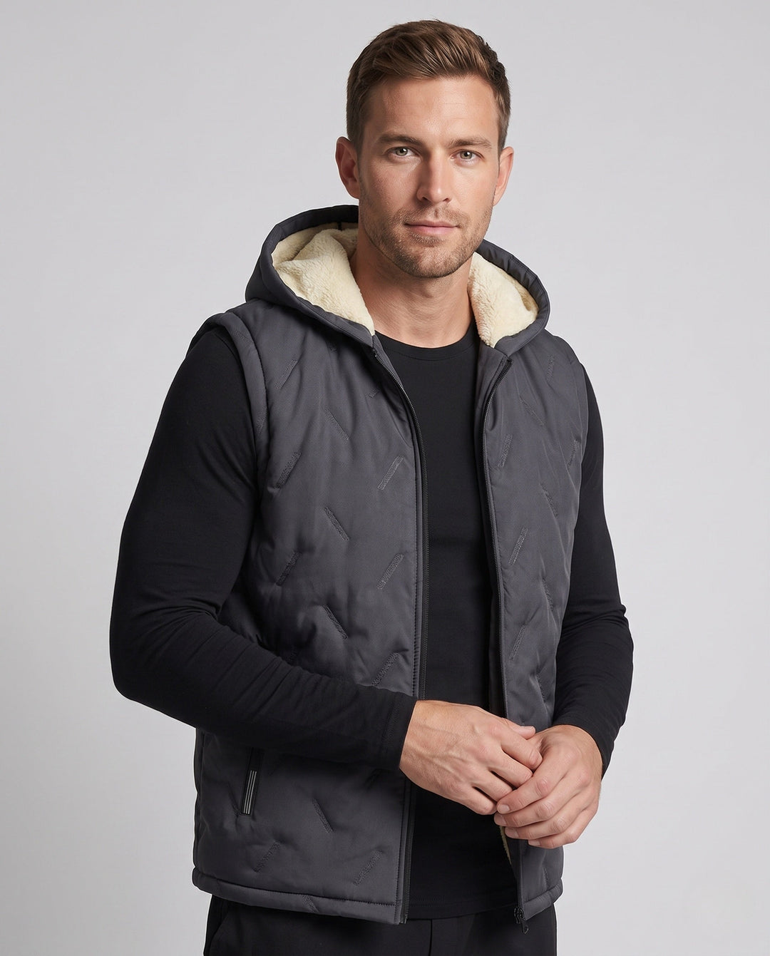 Men's quilted hooded vest with warming Sherpa lining and concealed zip pockets