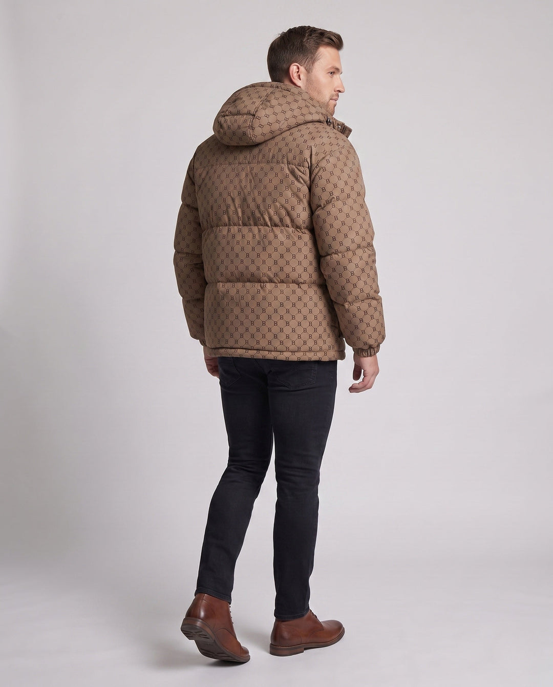 Men's quilted oversized parka with hood, allover monogram, snap button placket, and large patch pockets